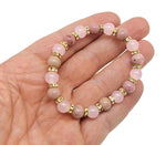Handmade empowerment gemstone bracelet with colorful beads and a charm, designed for positive intentions and personal growth.