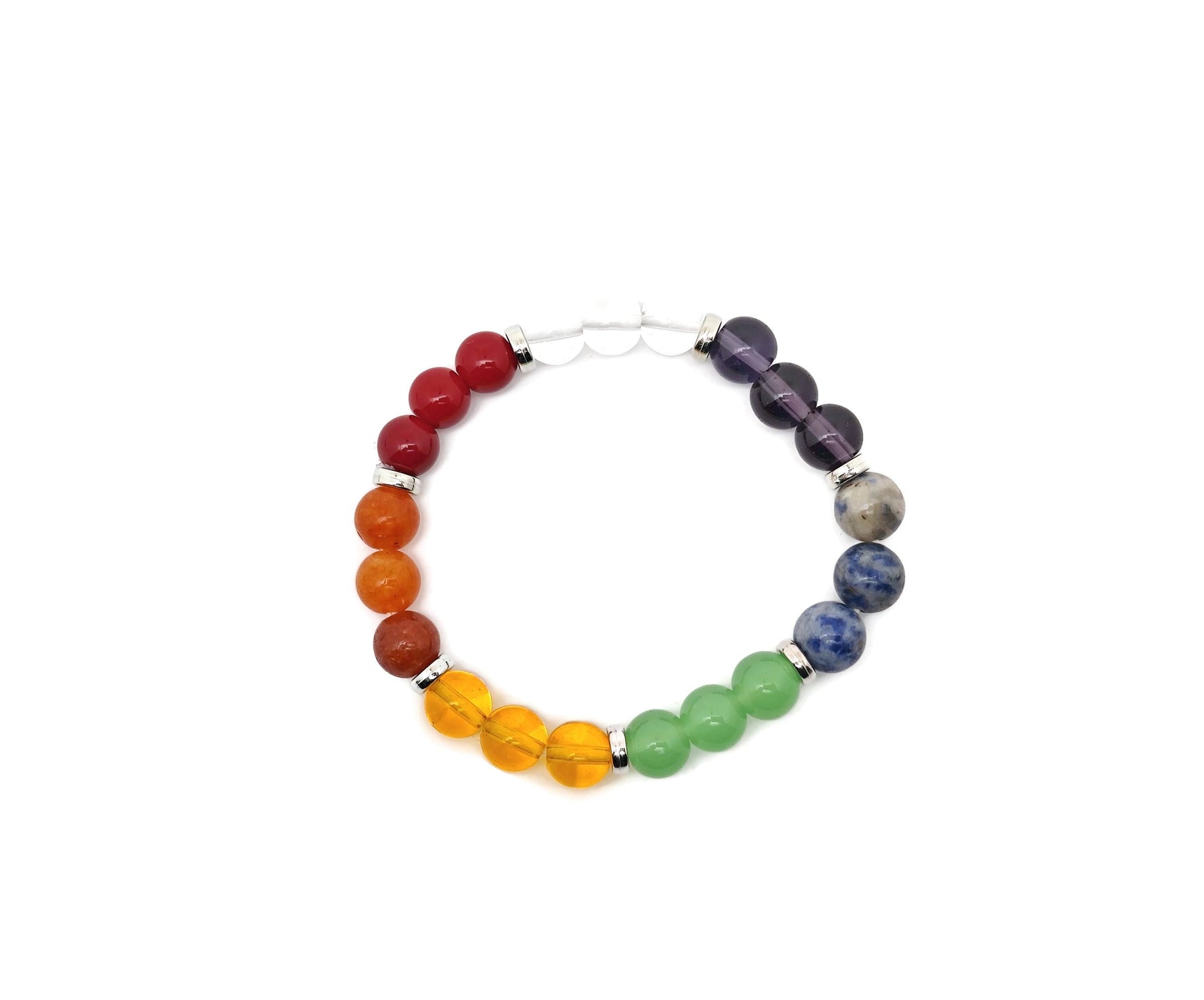 Handmade 7 Chakra gemstone bracelet with colorful beads and charms, designed for intention and spiritual balance.