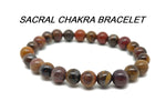 Handmade sacral chakra gemstone bracelet with colorful beads, designed for intention and energy balancing by GemstoneGO.