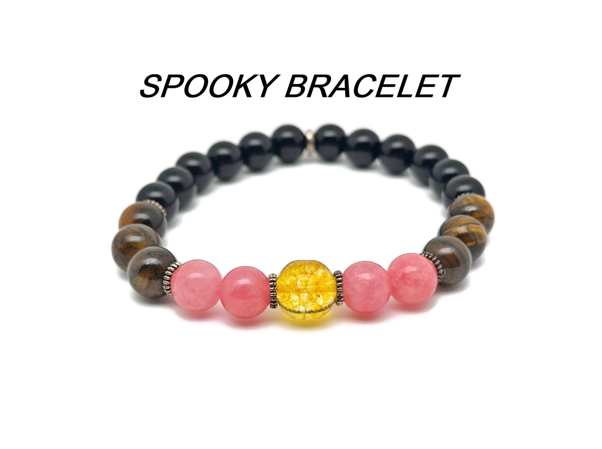 Handmade gemstone bracelet with spooky-themed beads from GemstoneGO, featuring a unique intention design and dark gemstone accents.