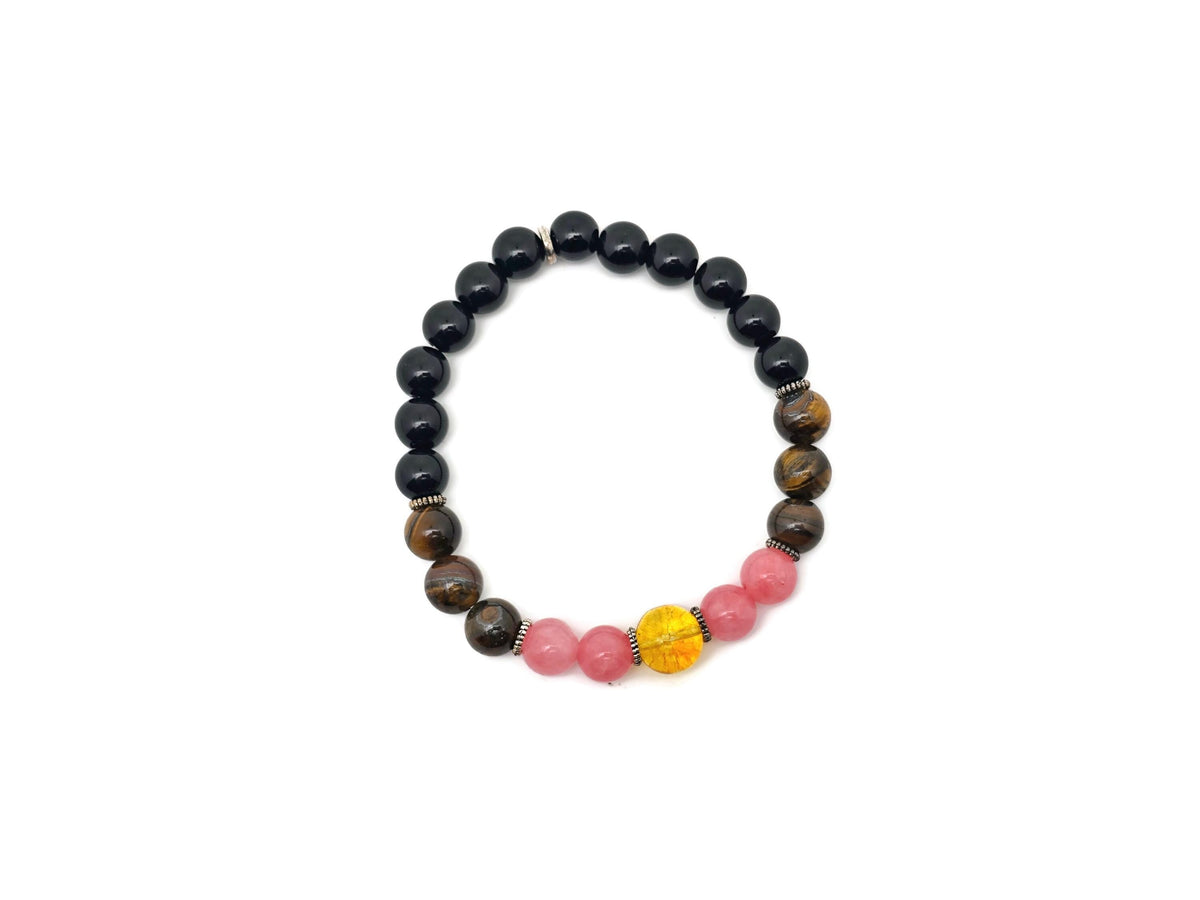 Handmade spooky gemstone bracelet featuring dark stones and intricate details, perfect for intention and stylish accessory use.