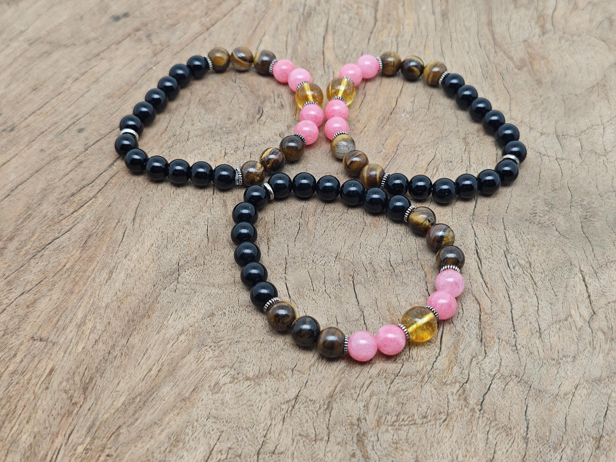 Handmade spooky gemstone bracelet with colorful stones and adjustable cord, designed for intention and stylish wear by GemstoneGO.