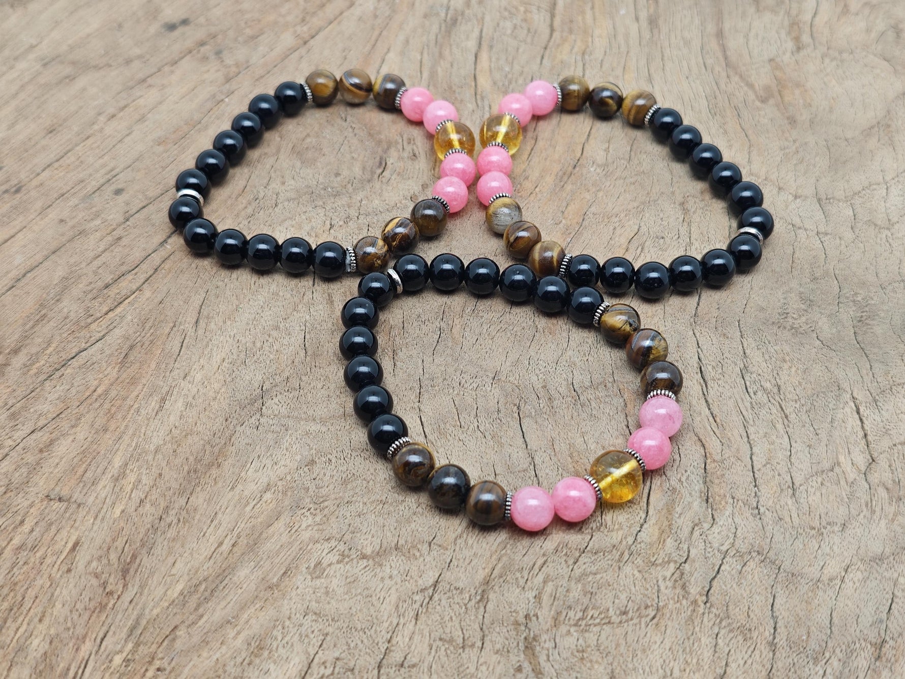 Handmade spooky gemstone bracelet with colorful stones and adjustable cord, designed for intention and stylish wear by GemstoneGO.