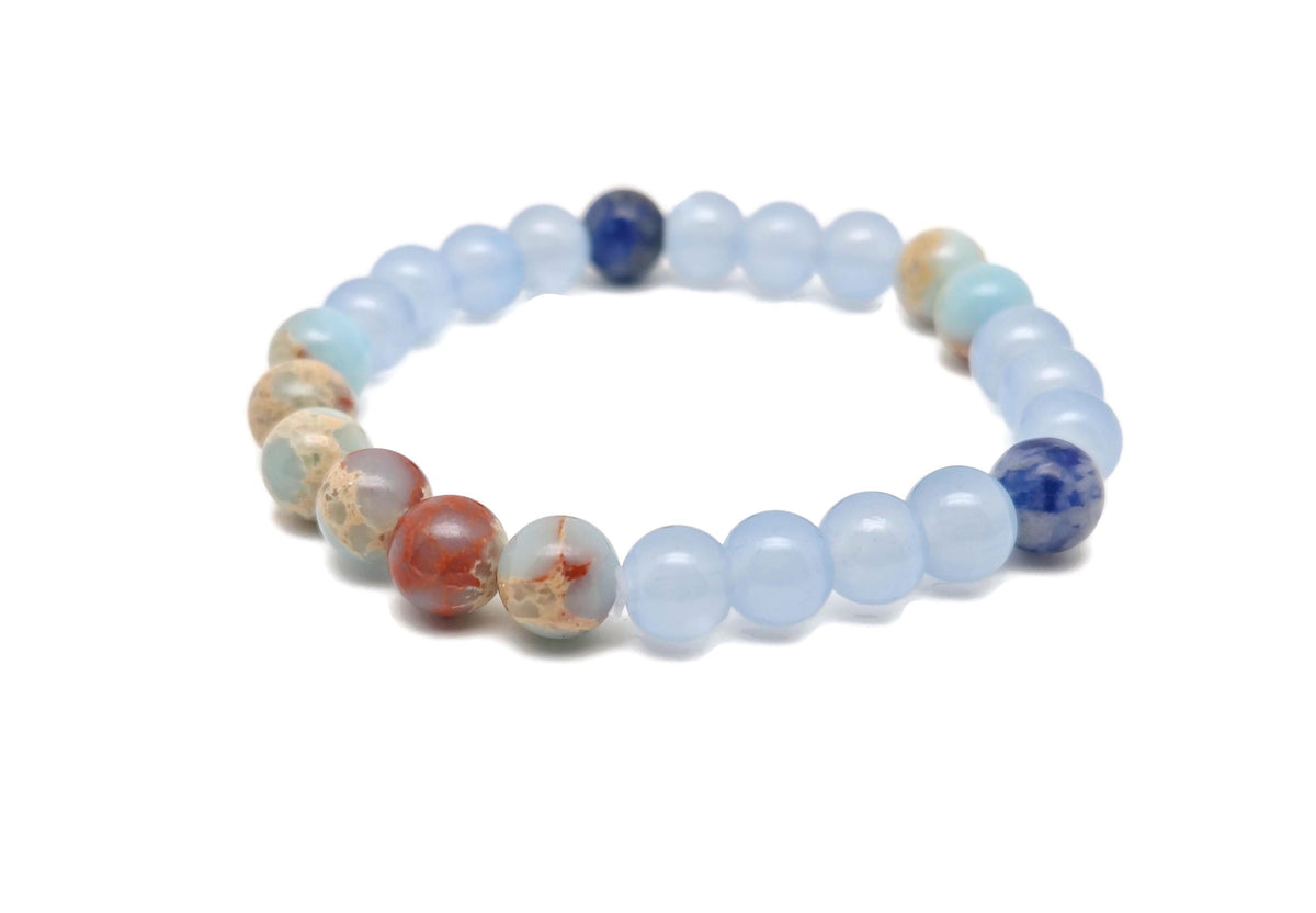 Handmade third eye chakra gemstone bracelet featuring colorful beads and a charm, designed for intention and spiritual balance.