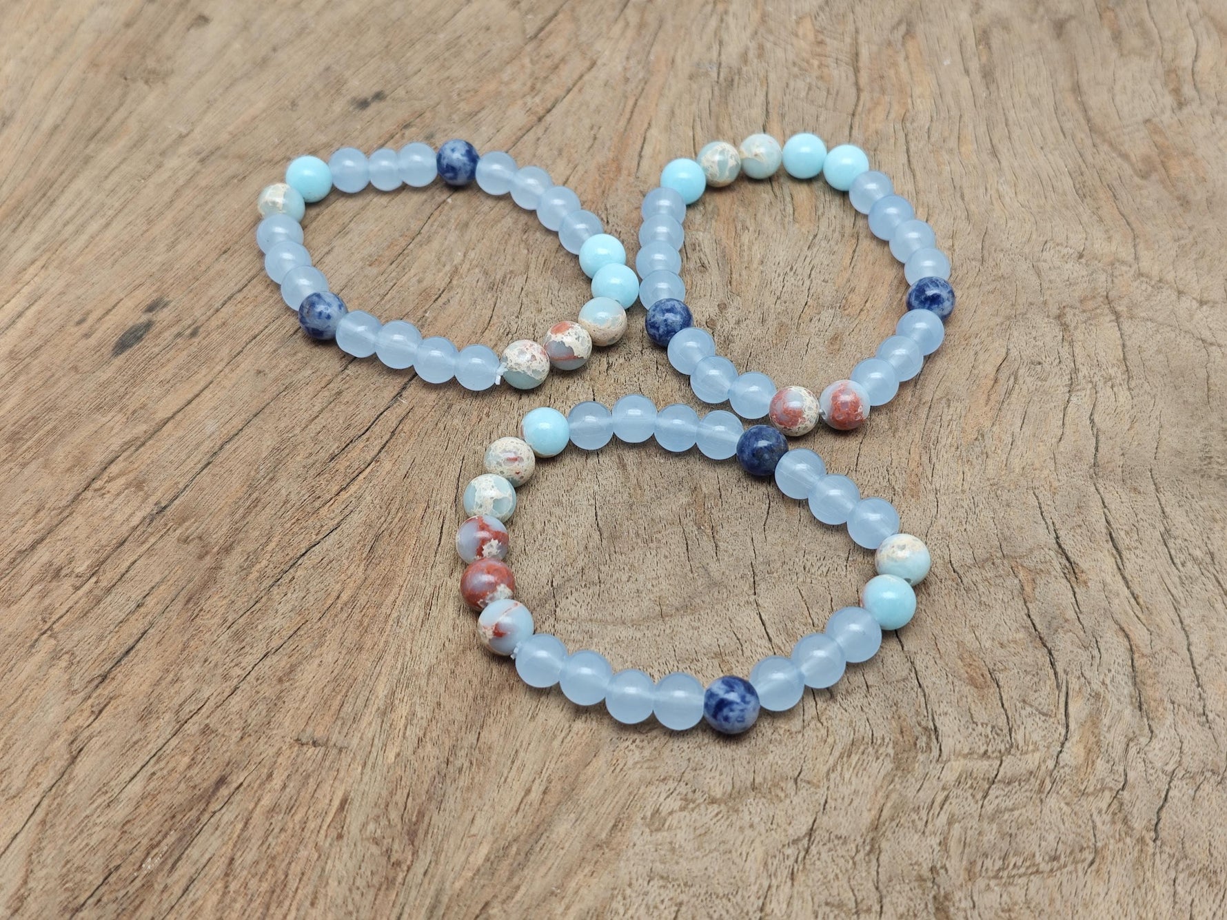Handmade third eye chakra gemstone bracelet featuring colorful natural stones and adjustable cord for spiritual intention and style.