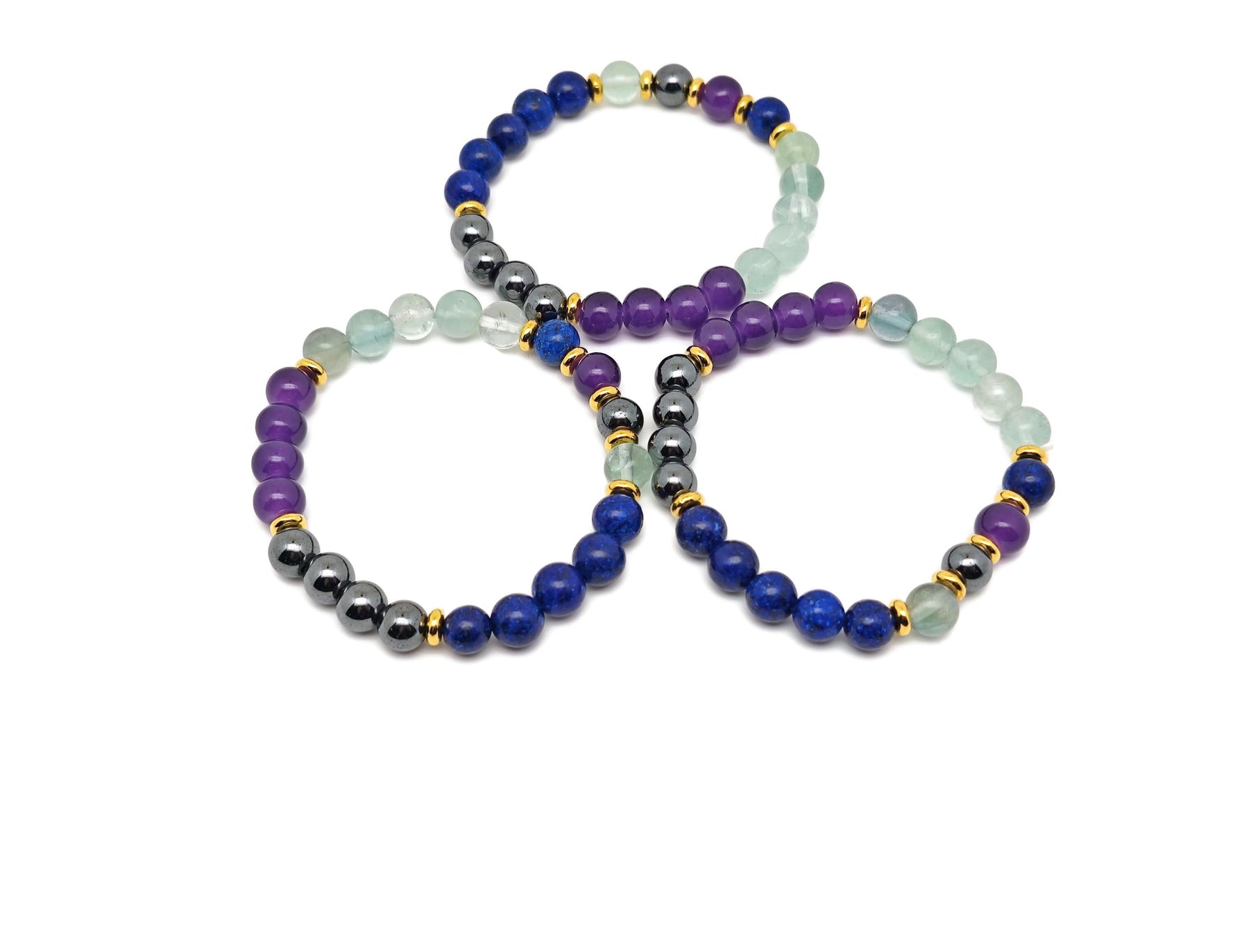 Handmade root chakra gemstone bracelet with natural stones, featuring a beaded design and adjustable cord for spiritual intention.