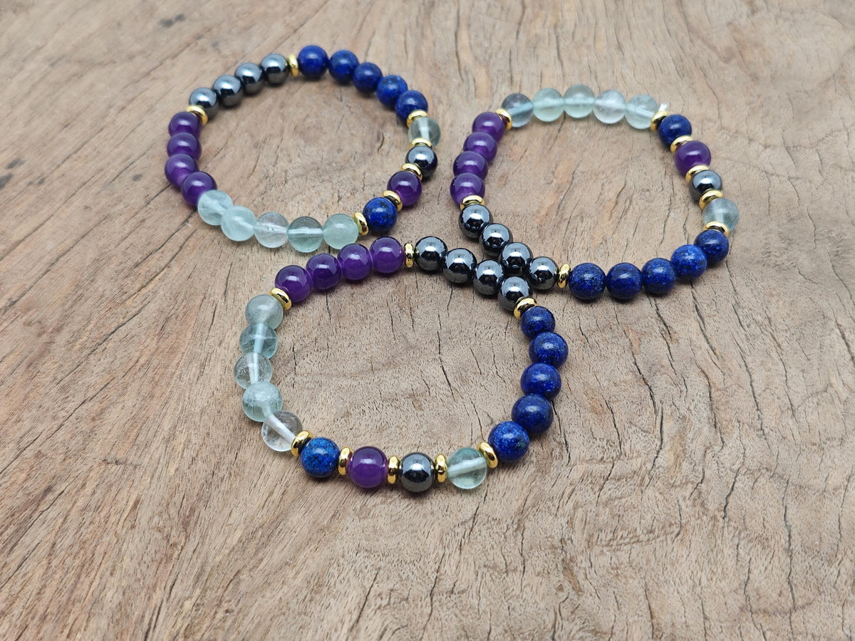 Handmade root chakra gemstone bracelet with red stones and adjustable cord from GemstoneGO, designed for balancing energy and intention.