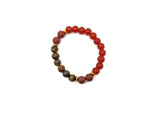 Handmade gemstone stability bracelet featuring colorful beads and a natural stone charm, designed for intention and grounding.