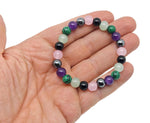 Handmade Crown Chakra gemstone bracelet with colorful beads from GemstoneGO, designed for intention and spiritual balance.