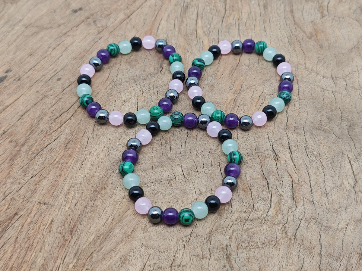 Handmade Crown Chakra gemstone bracelet with colorful beads, designed for intention and spiritual energy healing by GemstoneGO.