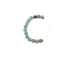Handmade gemstone bracelet with luck and fortune charms, featuring colorful beads and adjustable cord for positive intentions.