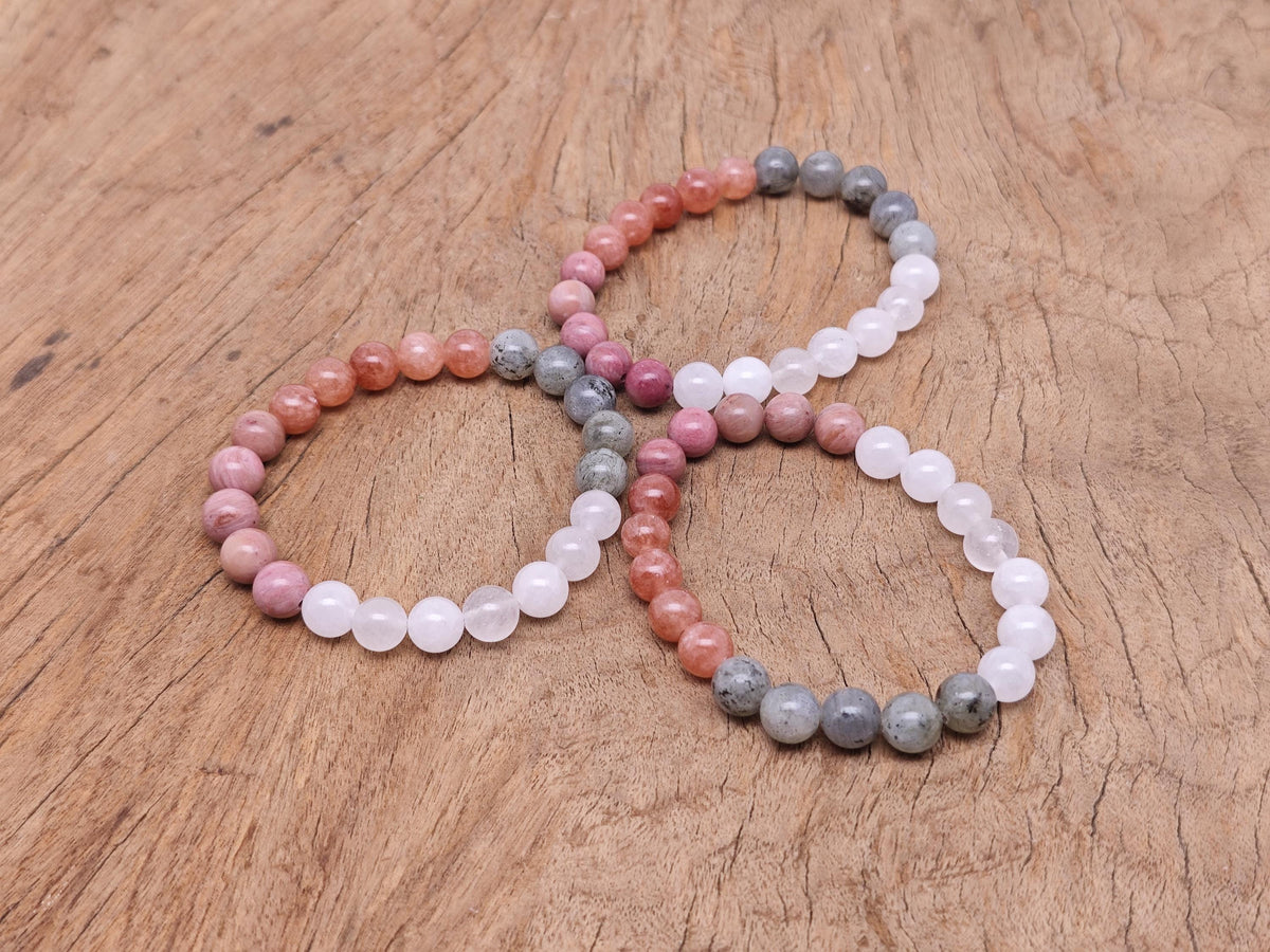 Handmade self-love gemstone bracelet with colorful beads and a silver clasp, designed for positive intentions and personal empowerment.