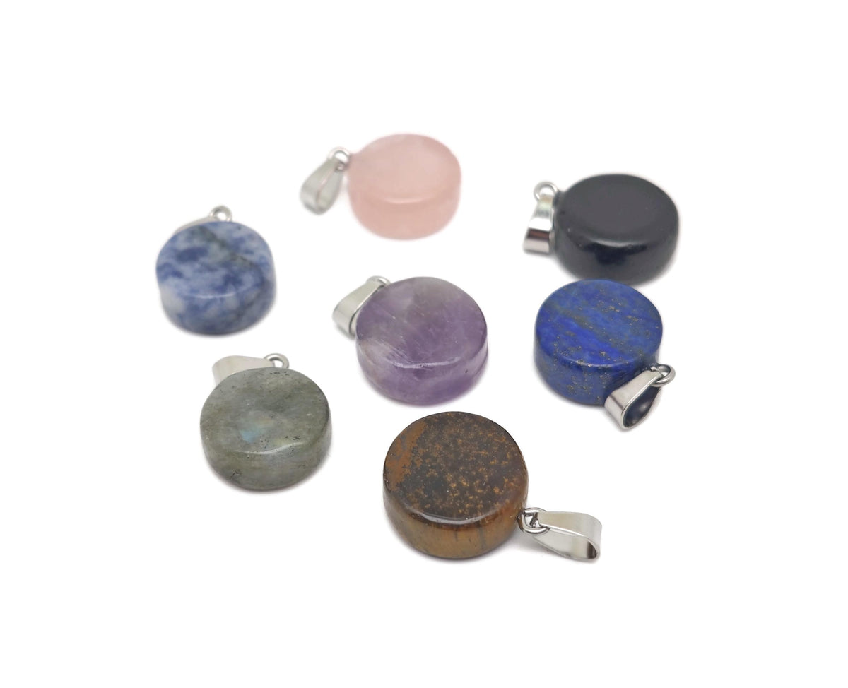 Round gemstone pendant featuring a clear crystal cabochon, showcasing a smooth, polished surface and vibrant gemstone colors by GemstoneGO.