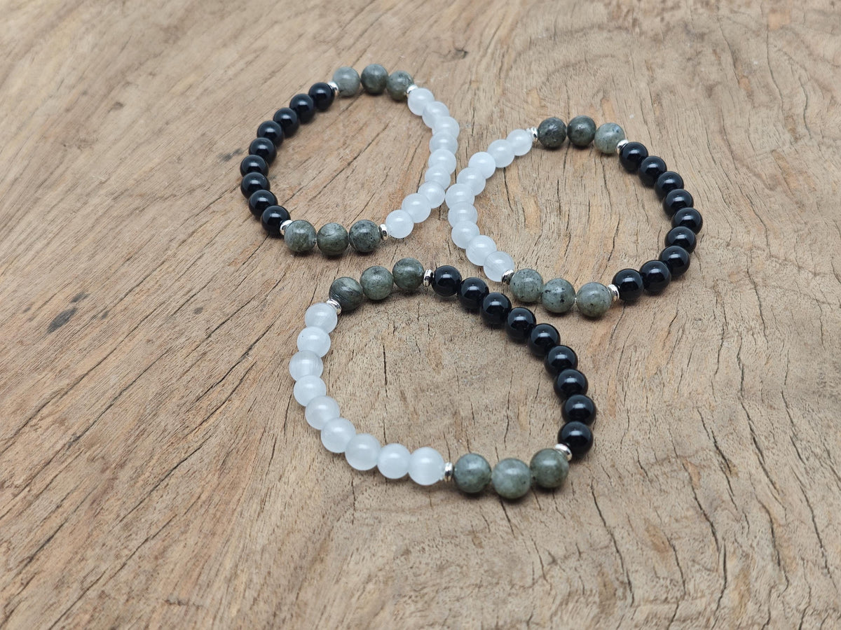 Handmade protection gemstone bracelet with colorful beads and adjustable cord, designed for positive intentions.