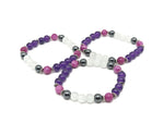 Handmade gemstone bracelet from GemstoneGO featuring colorful stones on a delicate cord, designed for sleep and positive intentions.