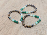 Handmade gemstone bracelet with colorful beads and a charm, designed for positive intentions, by GemstoneGO.