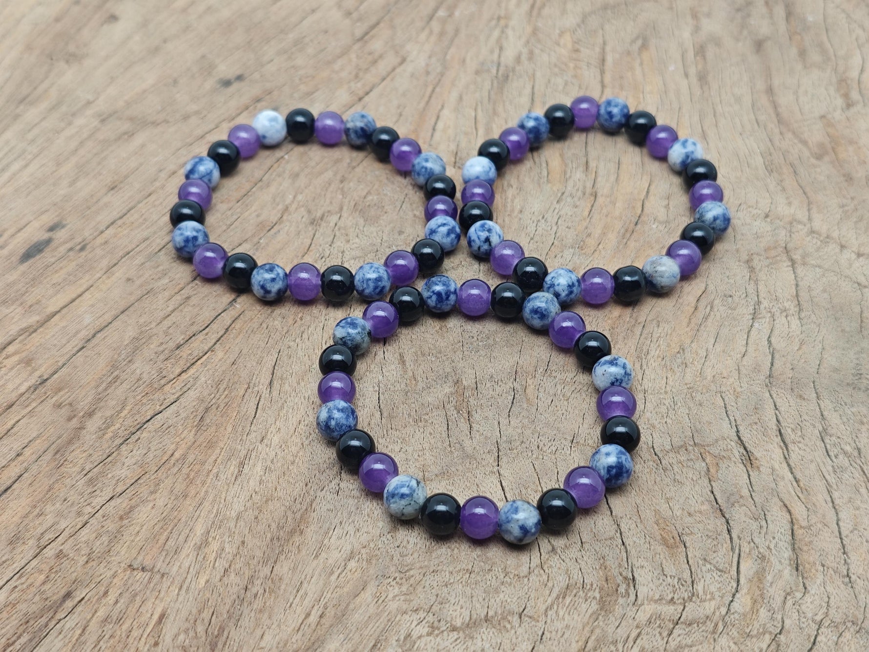 Handmade gemstone bracelet with smooth beads, designed for intention and soothing energy, by GemstoneGO.