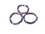 Handmade Heal gemstone bracelet with colorful stones and adjustable cord, designed for positive intentions and healing.