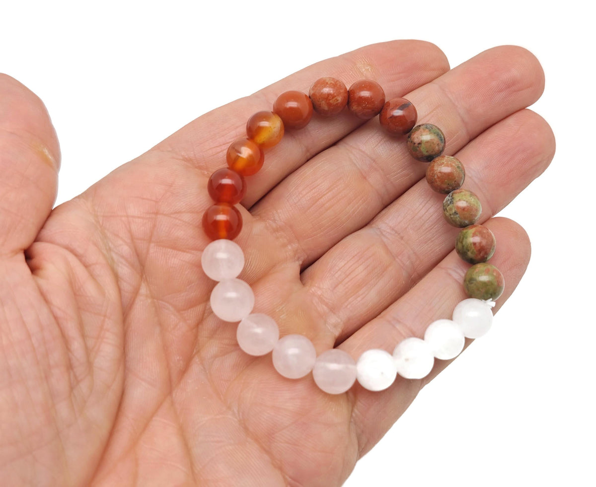Handmade fertility gemstone bracelet with colorful beads and adjustable cord, designed for intention and spiritual wellness.