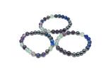 Handmade gemstone memory bracelet with colorful beads and a charm, designed for intention setting by GemstoneGO.