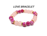 Handmade Love Gemstone Bracelet by GemstoneGO featuring colorful gemstone beads and a heart charm on a delicate string.