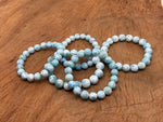Larimar beaded crystal bracelet for men and women, stretchy design, featuring healing AA-grade gemstones from GemstoneGO.