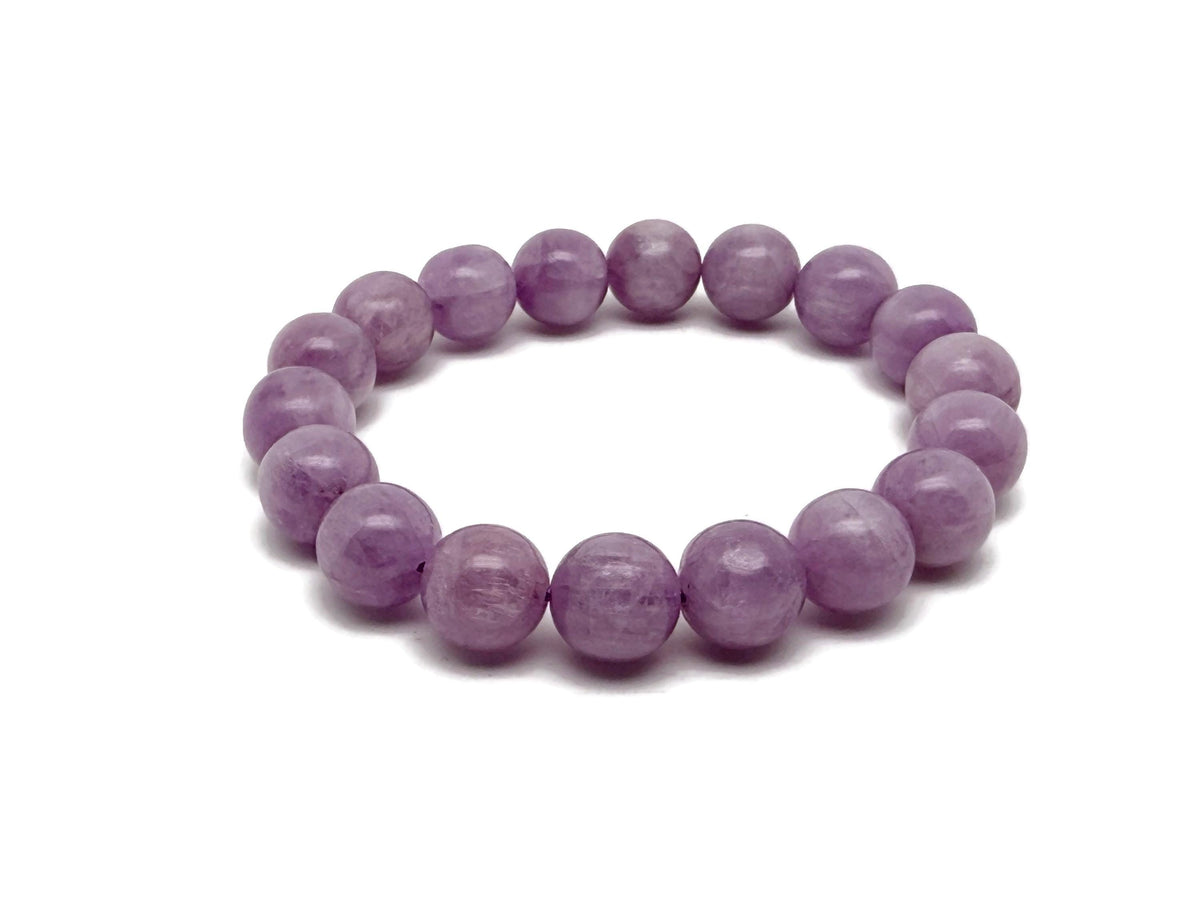 Kunzite beaded crystal bracelet for men and women with stretchy design, featuring polished pink stones for crystal healing.