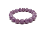Kunzite beaded crystal bracelet for men and women with stretchy design, featuring polished pink stones for crystal healing.