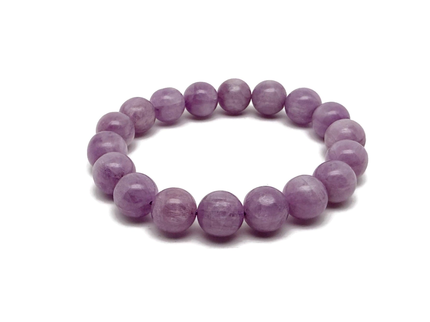 Kunzite beaded crystal bracelet for men and women with stretchy design, featuring polished pink stones for crystal healing.