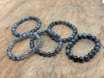 Tourmalinated Quartz beaded bracelet with black and clear crystals, stretchy design for men and women, ideal for crystal healing.