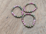 Handmade gemstone stress relief bracelet with colorful stones, designed for relaxation and positive intention by GemstoneGO.