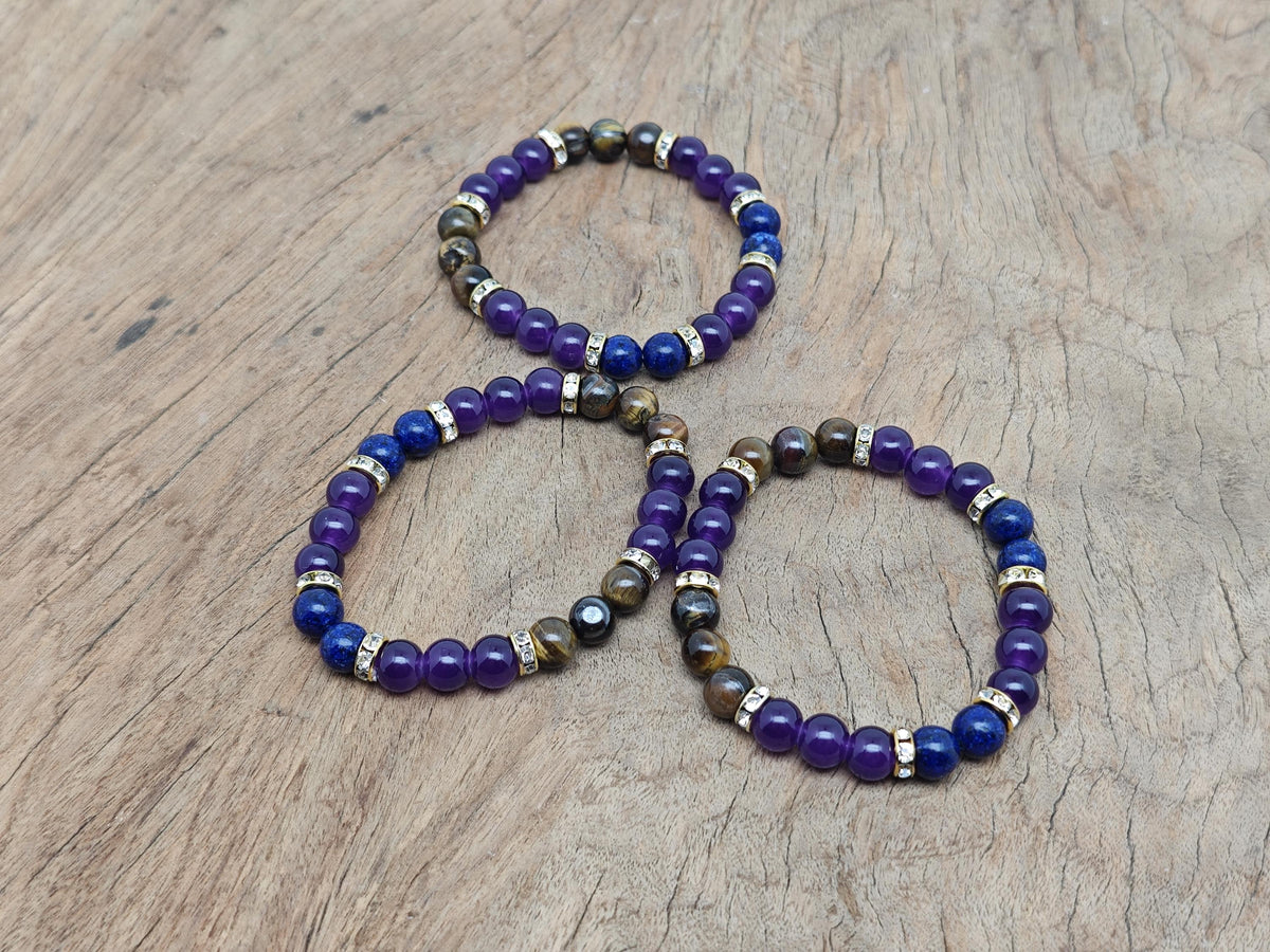 Handmade triple protection gemstone bracelet with colorful beads and intricate design, featuring natural stones for positive intention.