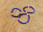 Handmade emf protection gemstone bracelet with colorful beads, designed for positive energy and intention.