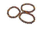 Handmade sacral chakra gemstone bracelet with vibrant orange beads, designed for intention and energy alignment by GemstoneGO.