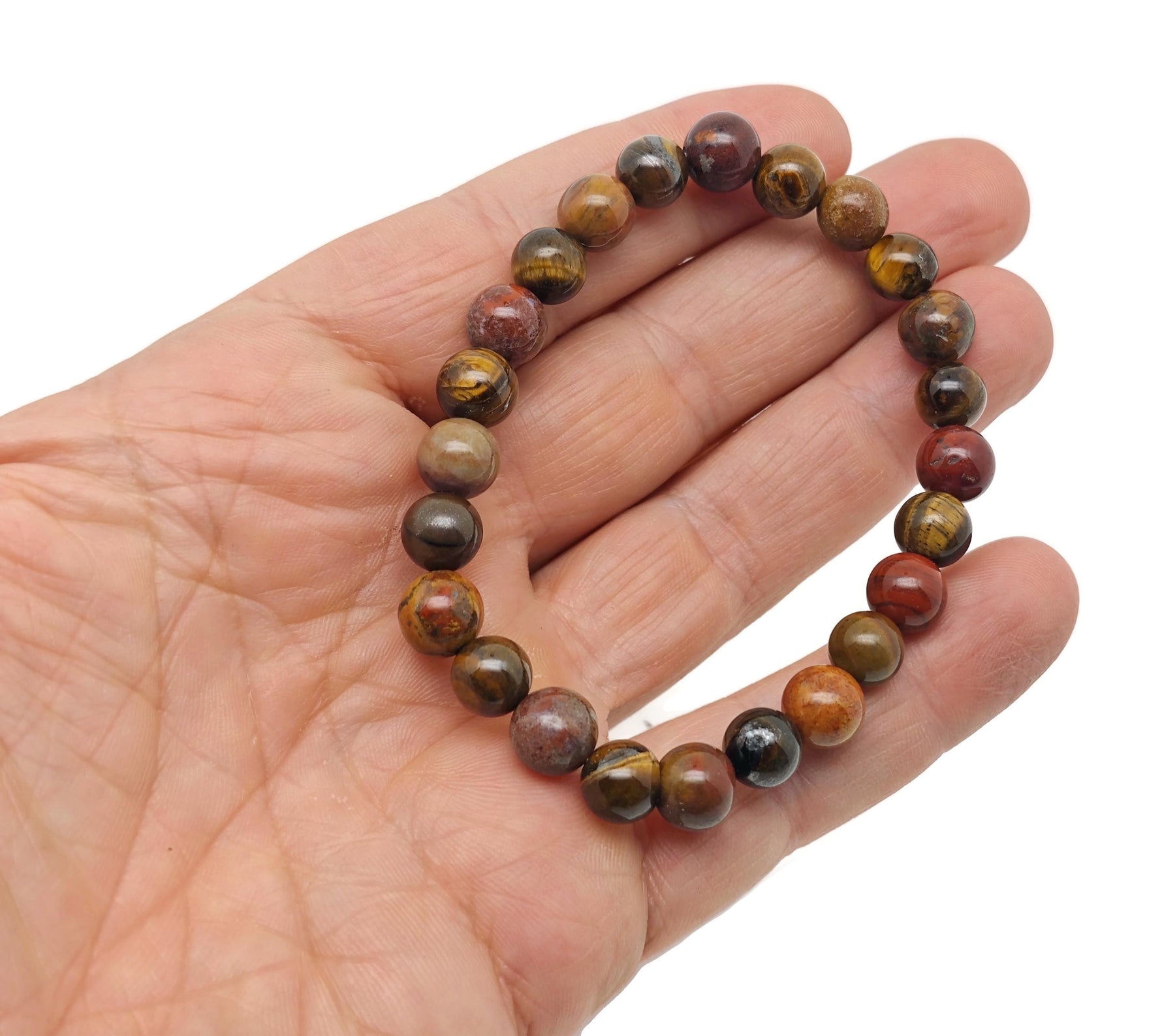 Handmade sacral chakra gemstone bracelet featuring vibrant orange stones and adjustable cord for positive energy and intention.