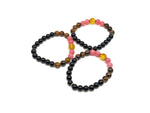 Handmade spooky gemstone bracelet featuring dark stones and unique design, perfect for intention-setting and everyday wear.