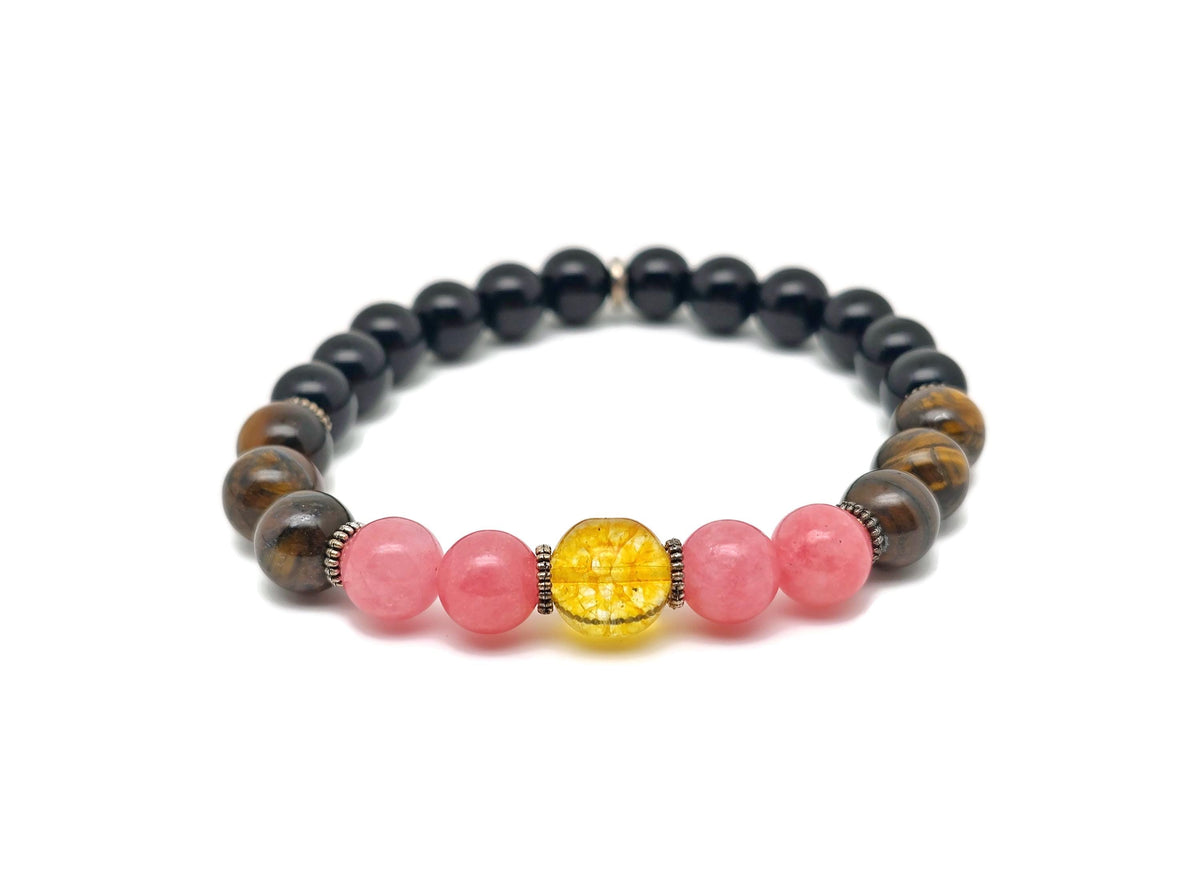 Handmade spooky gemstone bracelet featuring dark-colored stones, designed for intention and stylish accessory by GemstoneGO.