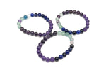 Handmade gemstone bracelet with colorful beads and silver accents, designed as an intention or transformation jewelry piece by GemstoneGO.