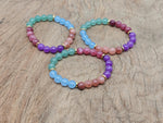Handmade gemstone bracelet with colorful beads, designed for positive intention, by GemstoneGO.