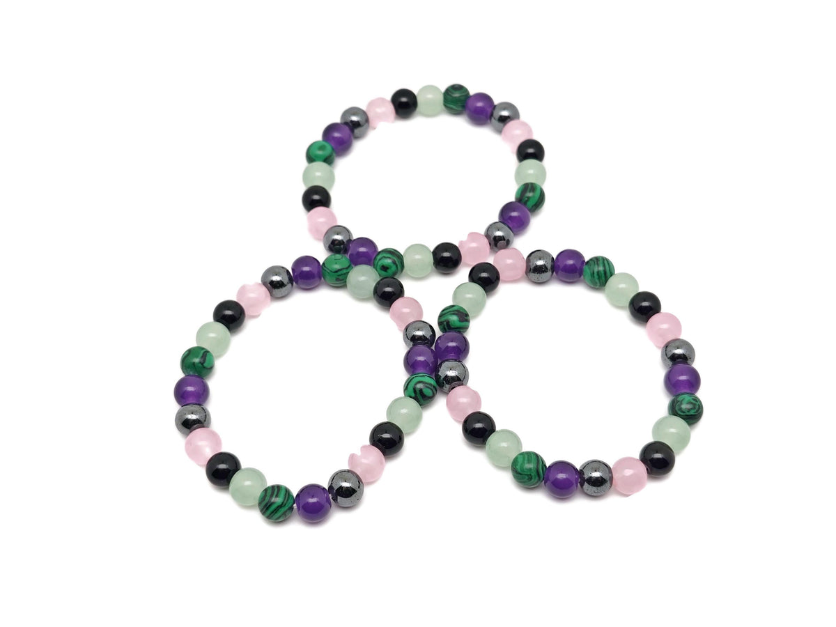 Handmade Crown Chakra gemstone bracelet featuring colorful beads, designed for spiritual intention and chakra balancing.