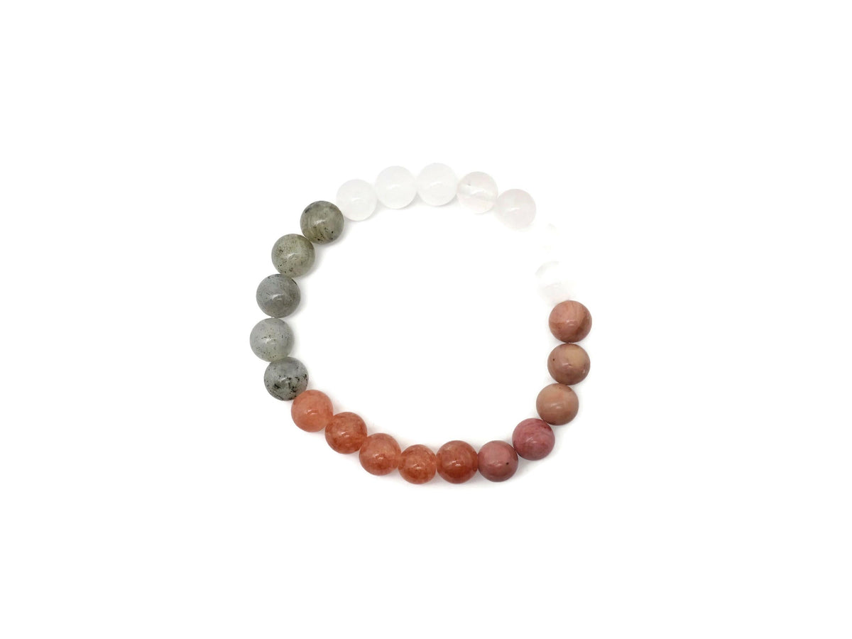 Handmade self-love gemstone bracelet with colorful beads and adjustable cord, designed for positive intentions and personal growth.