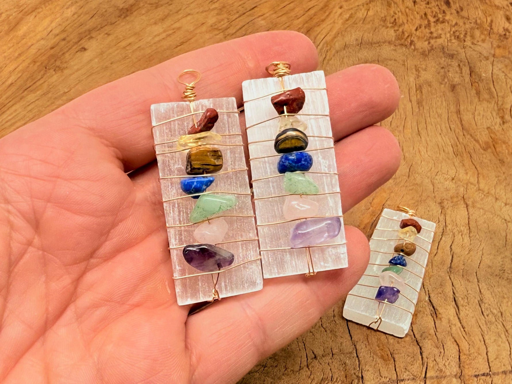 Selenite sticks pendant with chakra stones and gemstone accents, showcasing a natural, polished gemstone pendant design.