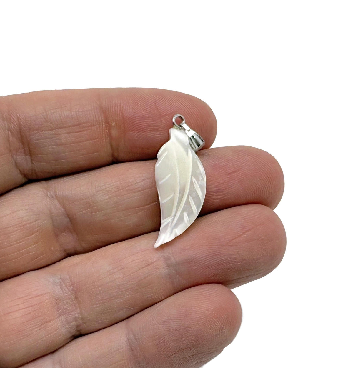Natural pearl and sea shell leaf pendant with gemstone accents, crafted by GemstoneGO, showcasing intricate jewelry design.