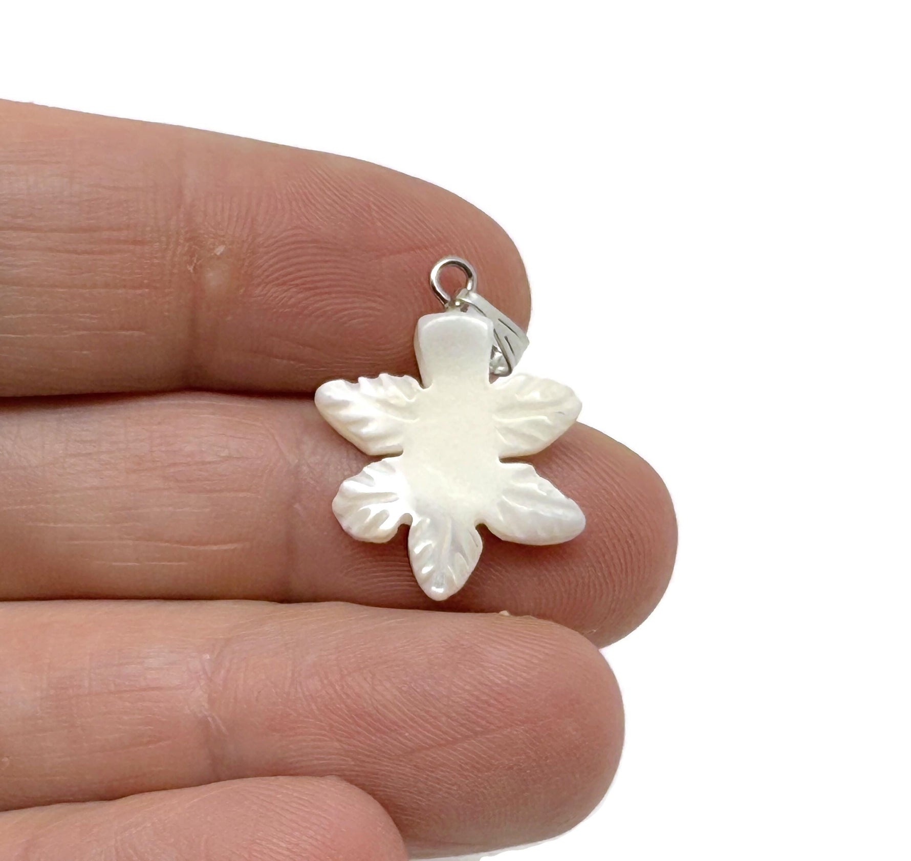 Natural pearl cloverleaf pendant with sea shell and gemstone accents, showcasing a delicate jewelry design by GemstoneGO.
