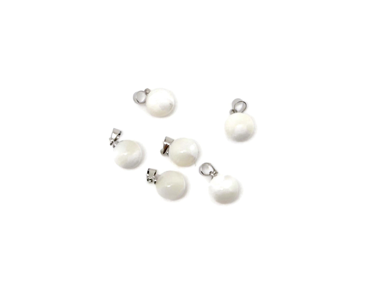 Natural pearl and sea shell gemstone pendant by GemstoneGO, featuring a spherical pearl ball and shell accents.