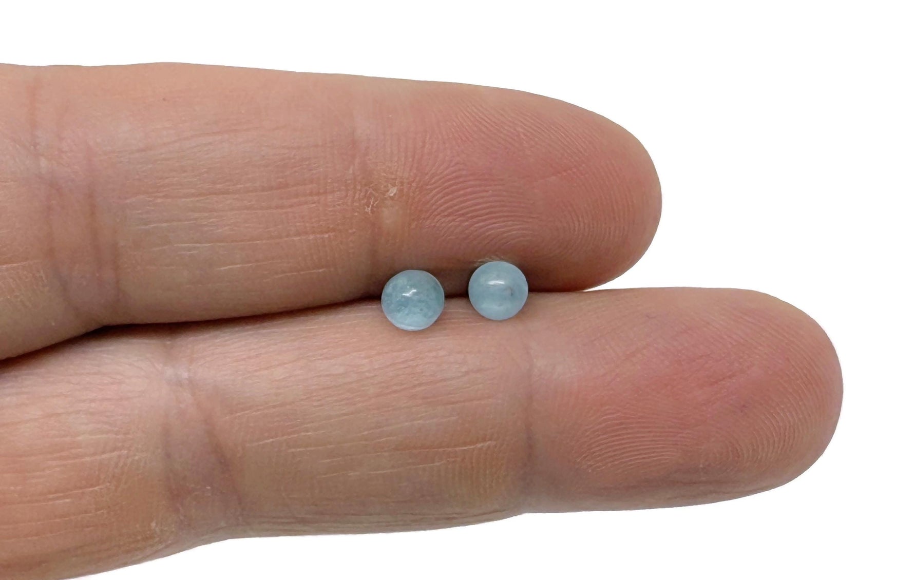 Sterling silver aquamarine stud earrings with crystal accents from GemstoneGO, showcasing a bright blue gemstone set in silver.