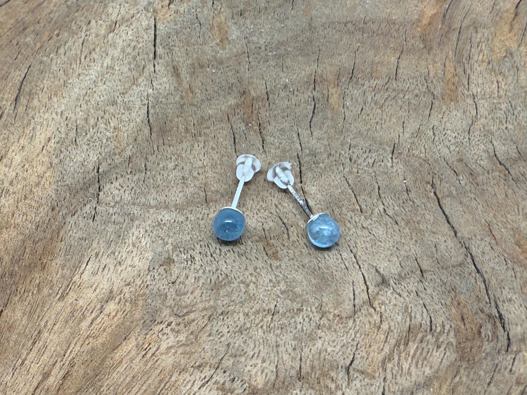 Sterling silver aquamarine stud earrings with crystal accents from GemstoneGO, showcasing elegant blue gemstone jewelry.