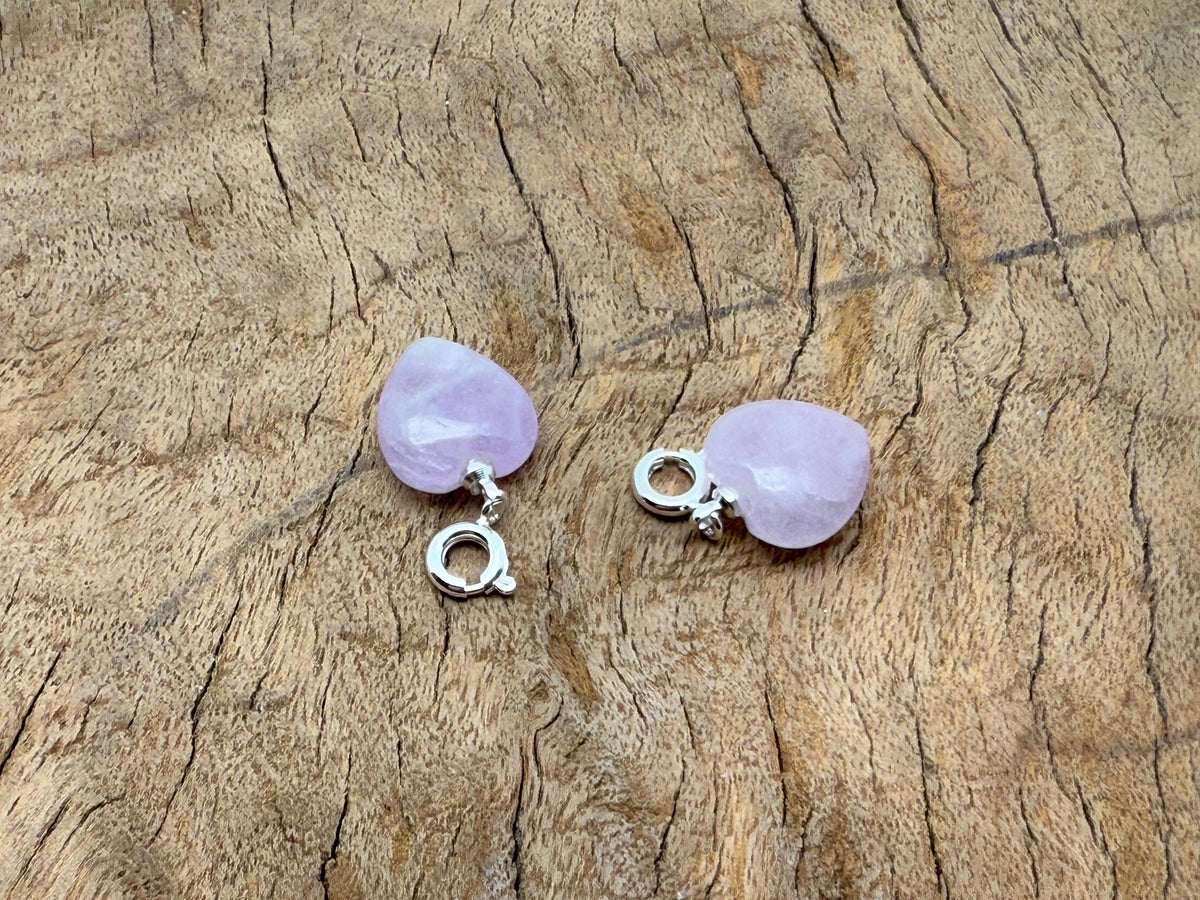 Kunzite heart-shaped crystal pendant by GemstoneGO, mini gemstone jewelry with pinkish-purple hues on a silver chain.