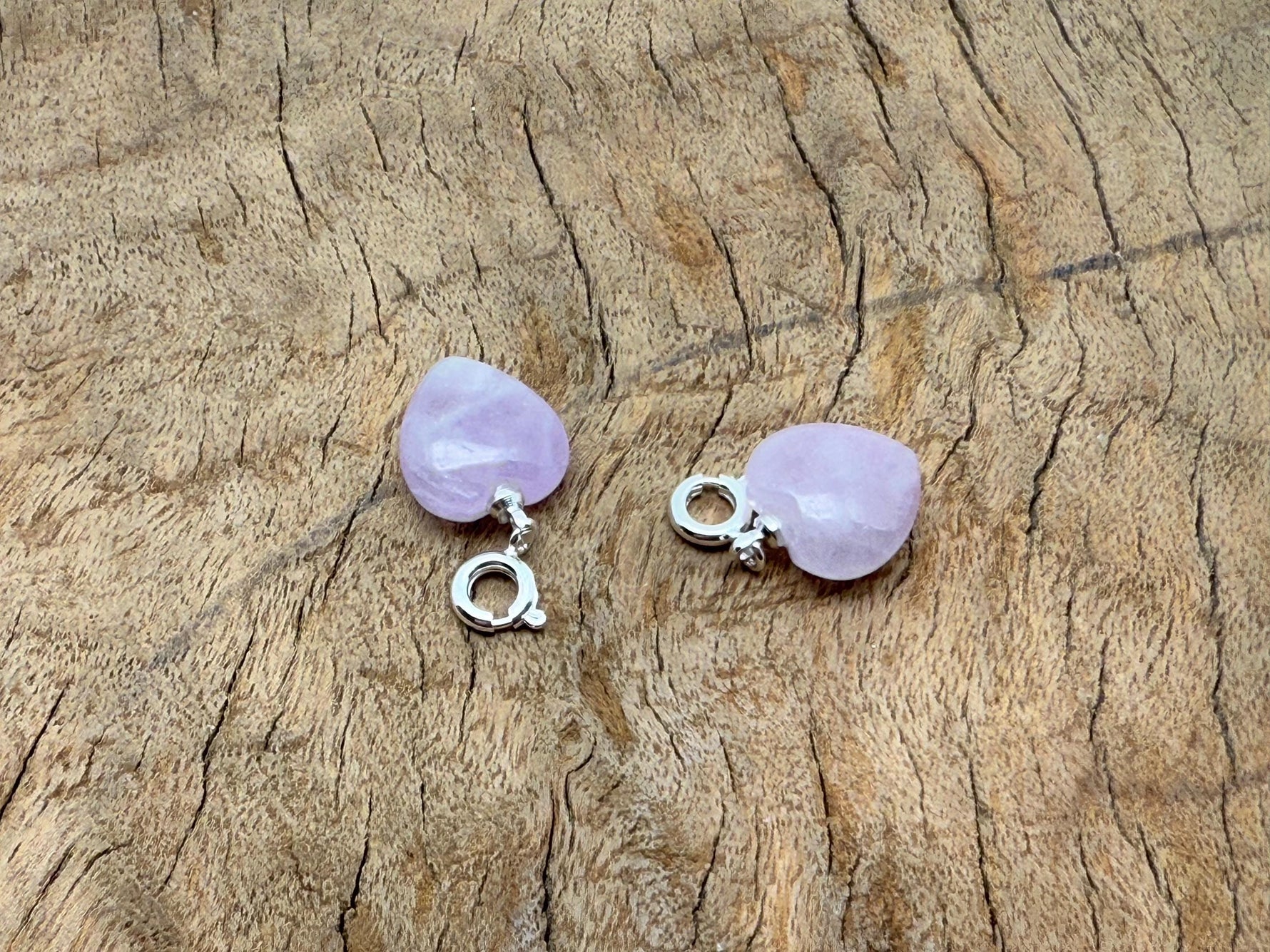 Kunzite heart-shaped crystal pendant by GemstoneGO, mini gemstone jewelry with pinkish-purple hues on a silver chain.