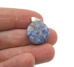Sodalite flat round gemstone pendant with a polished crystal coin shape, showcasing deep blue and white mineral patterns.